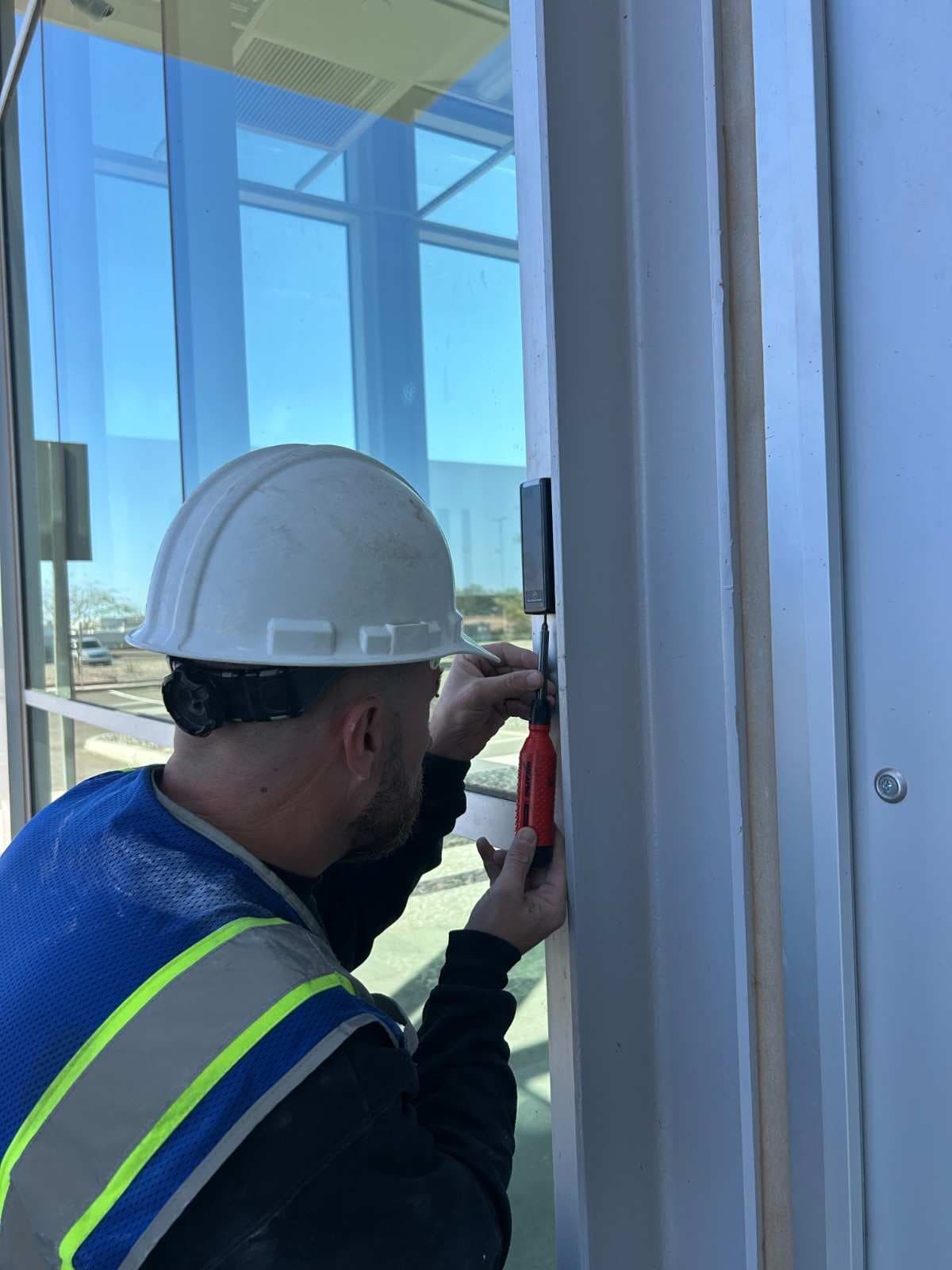 Security professional installing a security system
